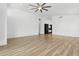 Minimalist style of living room offering lots of open space and neutral colors with wood-look flooring at 5403 E Cannon Dr, Paradise Valley, AZ 85253