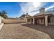 Large backyard with gravel and covered patio at 6632 E Fairbrook Cir, Mesa, AZ 85205