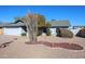 Single-story house with a gray exterior, a white garage door, and a landscaped front yard at 7808 W Mescal St, Peoria, AZ 85345