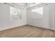 Bright bedroom with neutral walls and wood-look flooring at 9317 E Static Ave, Mesa, AZ 85212