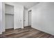 Spacious bedroom with a walk-in closet and wood-look flooring at 9317 E Static Ave, Mesa, AZ 85212