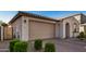 New construction home with a modern exterior and a two-car garage at 9317 E Static Ave, Mesa, AZ 85212