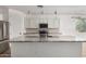 Kitchen island with granite countertop and pendant lighting at 9317 E Static Ave, Mesa, AZ 85212