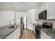 Modern kitchen with granite island and stainless steel appliances at 9317 E Static Ave, Mesa, AZ 85212