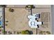 Bird's eye view displays the architectural design, solar panels and ample land of the property at 9437 W Avenida Del Sol Ave, Peoria, AZ 85383