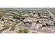 Expansive aerial showcases the property's large lot size surrounded by lush green spaces and neighboring homes at 9437 W Avenida Del Sol Ave, Peoria, AZ 85383