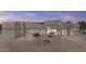 Expansive backyard with desert landscaping, covered patio, and outdoor grill, great for relaxing and entertaining at 9437 W Avenida Del Sol Ave, Peoria, AZ 85383