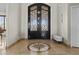 Elegant foyer featuring tile floors and ornate double doors at 9437 W Avenida Del Sol Ave, Peoria, AZ 85383