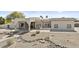 Elegant single-story house featuring decorative fountain, low-maintenance landscaping, and covered parking at 9437 W Avenida Del Sol Ave, Peoria, AZ 85383