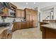 Spacious kitchen features custom wood cabinets, granite countertops, and stainless steel appliances at 9437 W Avenida Del Sol Ave, Peoria, AZ 85383
