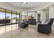 Spacious living room with open floor plan and view to outdoor living space at 9437 W Avenida Del Sol Ave, Peoria, AZ 85383