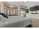 Serene main bedroom boasts a private patio, bay windows, and en-suite bathroom at 9437 W Avenida Del Sol Ave, Peoria, AZ 85383