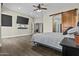 Bright bedroom with wood floors, recessed lights and sliding barn door at 9437 W Avenida Del Sol Ave, Peoria, AZ 85383