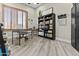 Bright office space with wood floors, built-in bookshelves and window with wooden shutters at 9437 W Avenida Del Sol Ave, Peoria, AZ 85383