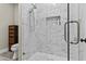 Updated bathroom with tiled shower, showerhead and clear glass door at 9437 W Avenida Del Sol Ave, Peoria, AZ 85383