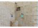 Walk-in shower features tile surround and a built-in shower seat at 9437 W Avenida Del Sol Ave, Peoria, AZ 85383