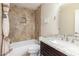 Bathroom features granite countertop, shower/tub combo and tiled walls at 9610 E Rocky Lake Dr, Sun Lakes, AZ 85248