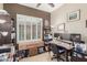Bright home office features built-in shelving and two computer monitors at 9610 E Rocky Lake Dr, Sun Lakes, AZ 85248