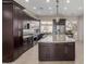 Spacious kitchen with large island and stainless steel appliances at 9610 E Rocky Lake Dr, Sun Lakes, AZ 85248