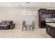 Kitchen with dark cabinets, granite counters, and breakfast nook at 9610 E Rocky Lake Dr, Sun Lakes, AZ 85248