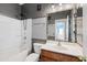 Bathroom with a tub, toilet, and vanity with mirror at 9931 W Odeum Ln, Tolleson, AZ 85353