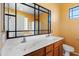 Bathroom with double sinks, mirror, and bathtub at 9931 W Odeum Ln, Tolleson, AZ 85353