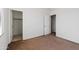 Simple bedroom with neutral walls and carpet at 9931 W Odeum Ln, Tolleson, AZ 85353