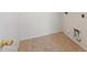 Laundry room with tile floor and built-in cabinets at 9931 W Odeum Ln, Tolleson, AZ 85353