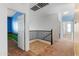 Upstairs hallway with carpet and access to bedrooms at 9931 W Odeum Ln, Tolleson, AZ 85353