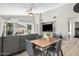 Open concept dining area with gray chairs and a wood table at 10103 E Olla Ave, Mesa, AZ 85212