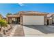 Single story home with a two car garage and walkway at 10103 E Olla Ave, Mesa, AZ 85212