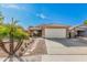 House exterior with a two-car garage and palm trees at 10103 E Olla Ave, Mesa, AZ 85212