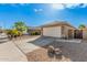 House exterior with a two-car garage and landscaping at 10103 E Olla Ave, Mesa, AZ 85212