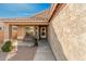 Inviting front porch with stone pathway and bench at 10103 E Olla Ave, Mesa, AZ 85212