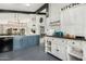 Bright kitchen with white cabinets, farmhouse style, and breakfast nook at 10103 E Olla Ave, Mesa, AZ 85212