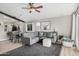 Spacious living room with grey sectional sofa and large artwork at 10103 E Olla Ave, Mesa, AZ 85212