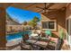 Covered patio features dining area and ceiling fan at 10103 E Olla Ave, Mesa, AZ 85212