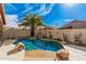 Inviting kidney-shaped pool with a waterfall feature at 10103 E Olla Ave, Mesa, AZ 85212