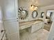 Bright bathroom with marble countertops, storage space, and a view into the bedroom at 10113 E Topaz Dr, Scottsdale, AZ 85258