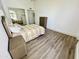 Well-lit bedroom with hard wood floors, a closet, and en suite bathroom at 10113 E Topaz Dr, Scottsdale, AZ 85258