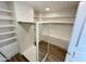 Spacious walk-in closet with custom shelving and ample storage space at 10113 E Topaz Dr, Scottsdale, AZ 85258