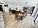 Dining room featuring modern lighting and furniture, with a view into the kitchen at 10113 E Topaz Dr, Scottsdale, AZ 85258