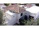 Exterior architectural detail of a multi-story home with a tile roof and white stucco at 10113 E Topaz Dr, Scottsdale, AZ 85258