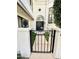 Close-up of the home's front entrance with a decorative wrought-iron gate and manicured greenery at 10113 E Topaz Dr, Scottsdale, AZ 85258