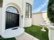 Beautiful home entrance featuring a well-manicured lawn and a decorative water feature at 10113 E Topaz Dr, Scottsdale, AZ 85258