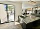 Stylish kitchen featuring a marble island with a sink, blending indoor and outdoor living at 10113 E Topaz Dr, Scottsdale, AZ 85258