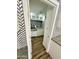 View into a kitchenette with white cabinets, patterned backsplash, and modern fixtures at 10113 E Topaz Dr, Scottsdale, AZ 85258