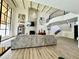 Bright living room featuring high ceilings, fireplace and staircase with wrought iron railings at 10113 E Topaz Dr, Scottsdale, AZ 85258