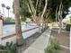 Scenic walkway by a tennis court showcasing community recreational opportunities with landscaping and trees at 10113 E Topaz Dr, Scottsdale, AZ 85258