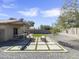 Landscaped backyard with patio and artificial turf at 1132 W 21St Ave, Apache Junction, AZ 85120